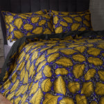 EW by Edinburgh Weavers Magali Tropical Printed Cotton Sateen Piped Duvet Cover Set in Ochre